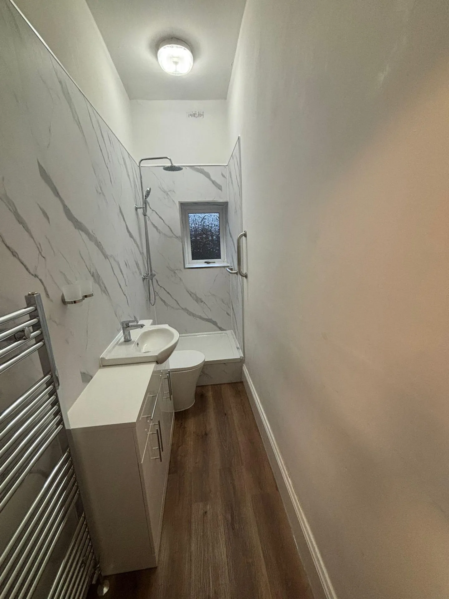 Narrow shower room installation in a bathroom under 95cm wide
