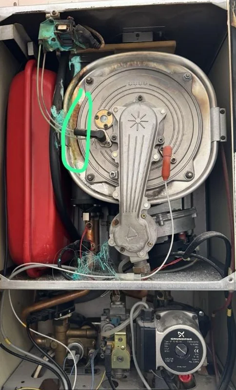 Before: the inside of an old boiler broken beyond repair through lack of maintenance
